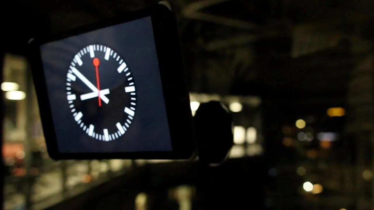 An iPad in a Deohako case mounted on a wall, showing a clock