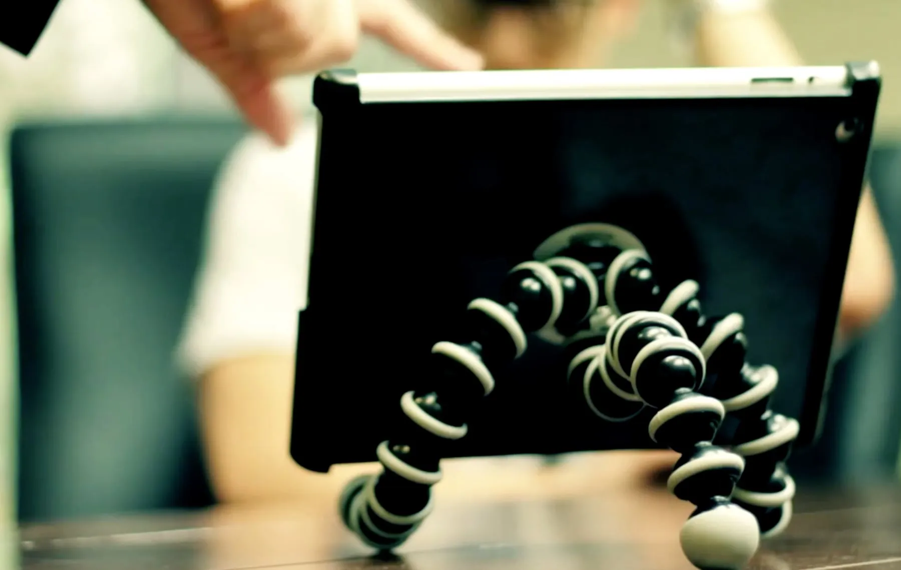 An iPad in a Deohako case standing on a bendable tripod